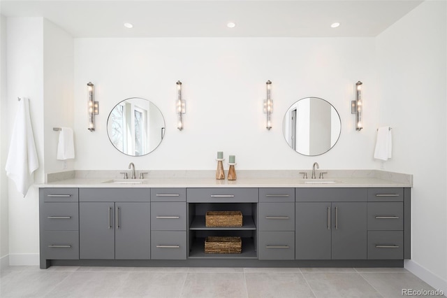 bathroom with double vanity and tile flooring