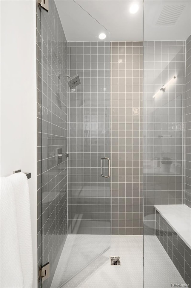 bathroom featuring an enclosed shower