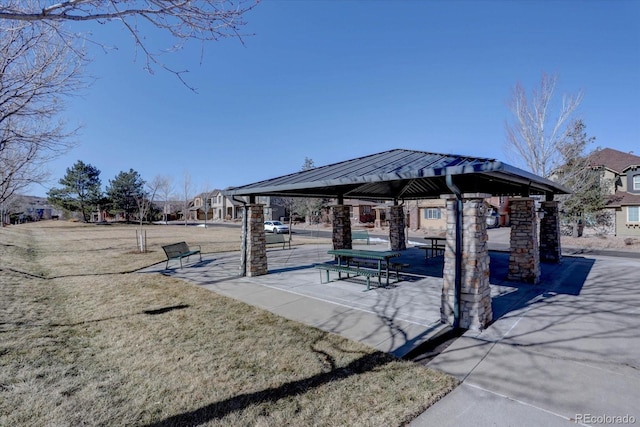 view of home's community with a gazebo and a lawn