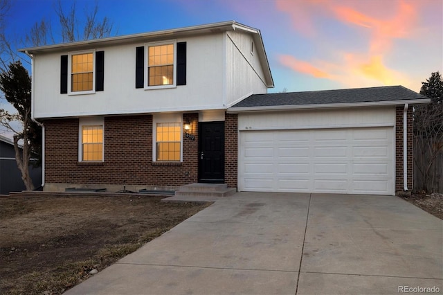 view of front of house with a garage, concrete driveway, brick siding, and a shingled roof