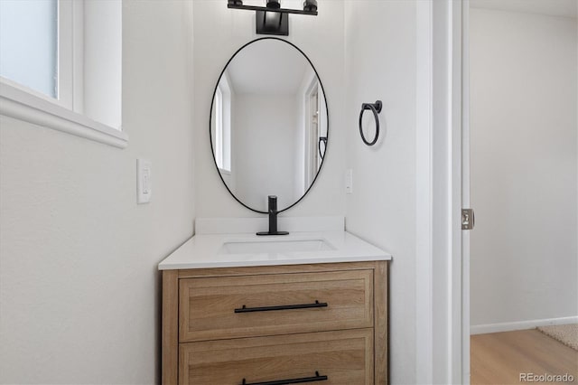 bathroom featuring wood finished floors and vanity