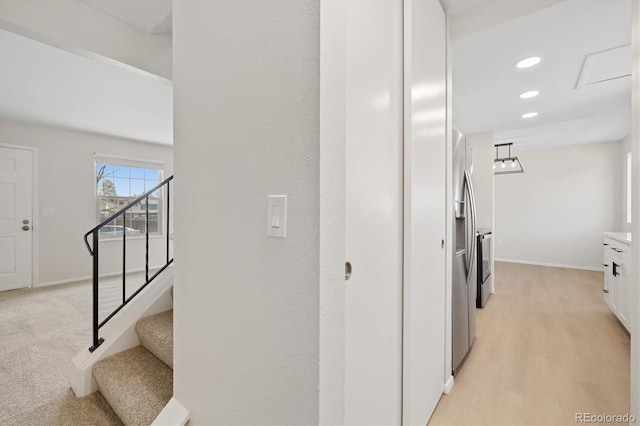 corridor with stairs, baseboards, and recessed lighting