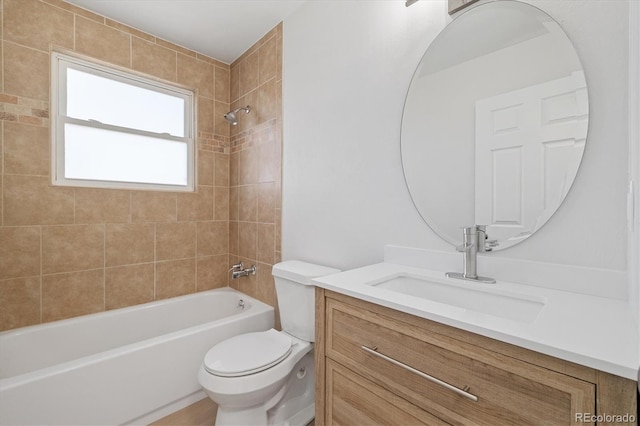 bathroom with bathtub / shower combination, vanity, and toilet