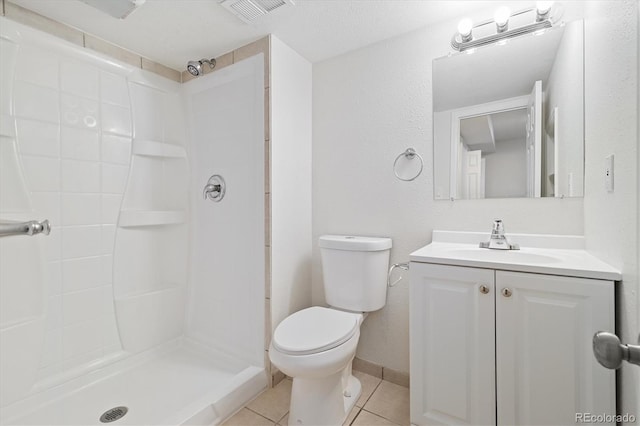 full bathroom with a stall shower, visible vents, toilet, tile patterned flooring, and vanity