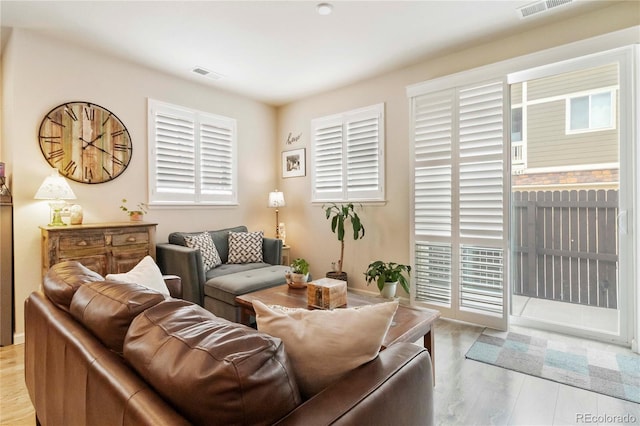 1640 Aspen Meadows Cir, Federal Heights, CO 80260 - living room featuring healthy amount of natural light and wood finished floors