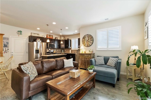 1640 Aspen Meadows Cir, Federal Heights, CO 80260 - living area featuring recessed lighting, light wood-style flooring, and baseboards