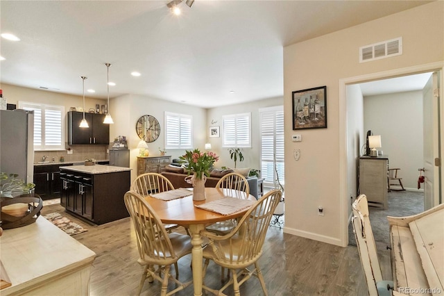 1640 Aspen Meadows Cir, Federal Heights, CO 80260 - dining space with plenty of natural light, light wood finished floors, recessed lighting, and baseboards