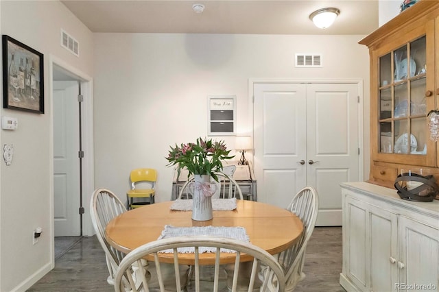 1640 Aspen Meadows Cir, Federal Heights, CO 80260 - dining room featuring dark wood-type flooring and baseboards