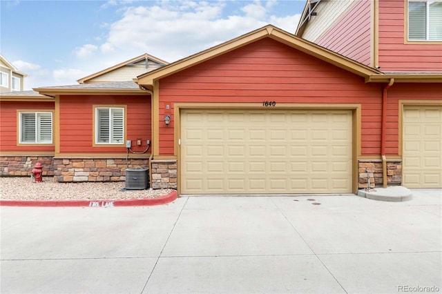 1640 Aspen Meadows Cir, Federal Heights, CO 80260 - view of front of property with stone siding and concrete driveway
