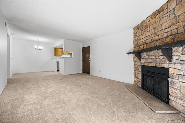 unfurnished living room featuring carpet floors, an inviting chandelier, and a fireplace