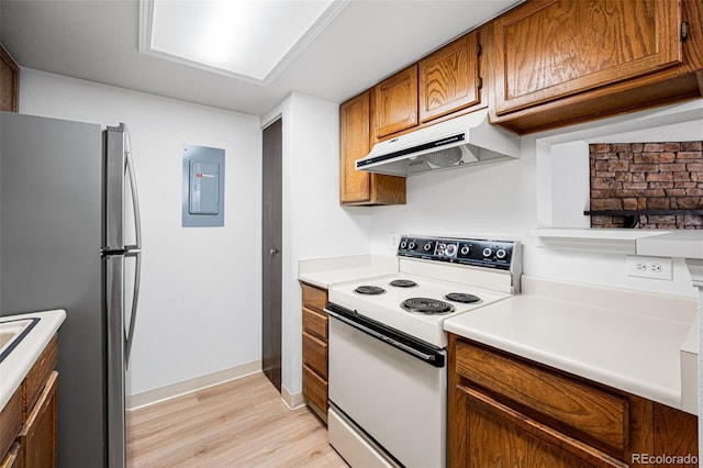 kitchen with electric range, electric panel, light wood-type flooring, and stainless steel refrigerator