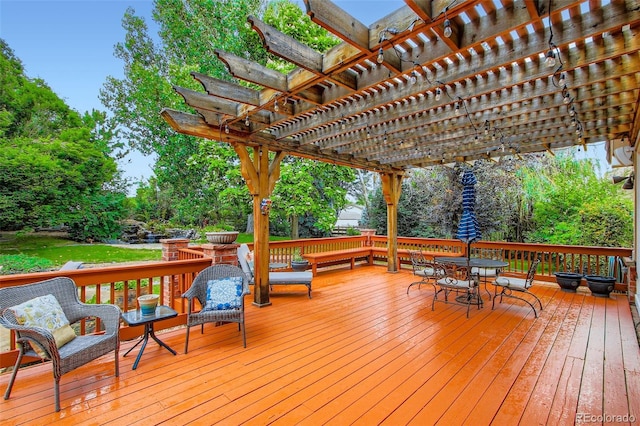 7355 Nile St, Arvada, CO 80007 - wooden deck featuring a pergola and outdoor dining area
