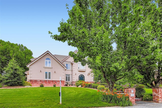 7355 Nile St, Arvada, CO 80007 - view of front of home with stucco siding and a front lawn