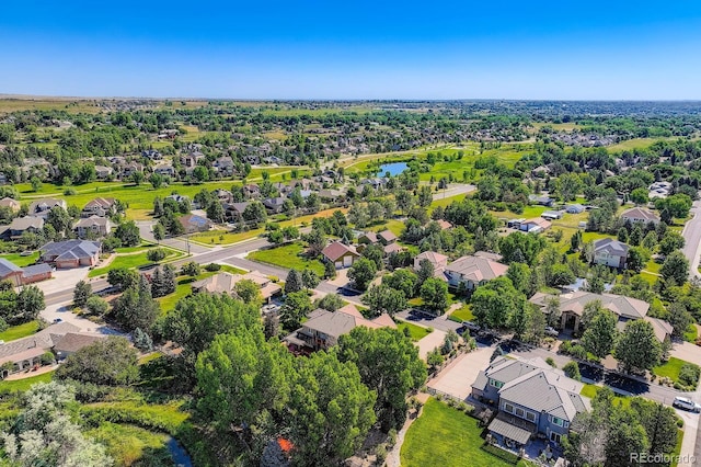 7355 Nile St, Arvada, CO 80007 - aerial perspective of suburban area featuring a nearby body of water
