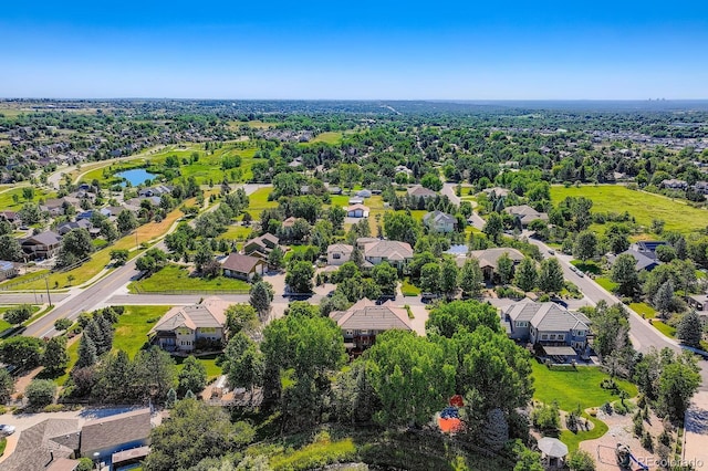 7355 Nile St, Arvada, CO 80007 - aerial perspective of suburban area featuring a nearby body of water