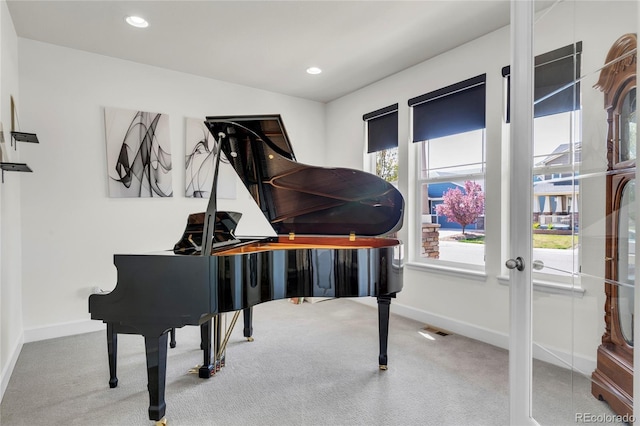 sitting room featuring carpet flooring, plenty of natural light, baseboards, and recessed lighting