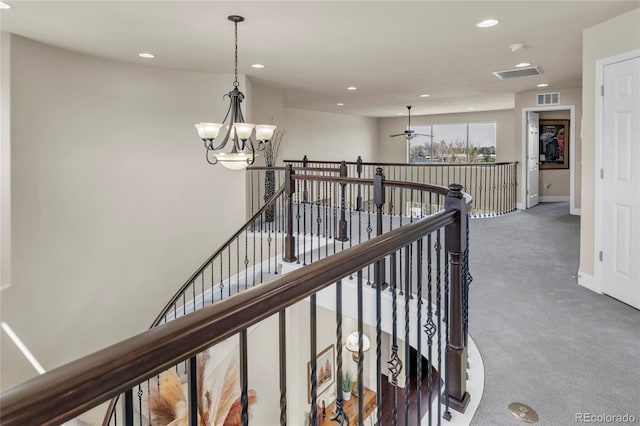 hall with carpet floors, a chandelier, recessed lighting, an upstairs landing, and baseboards