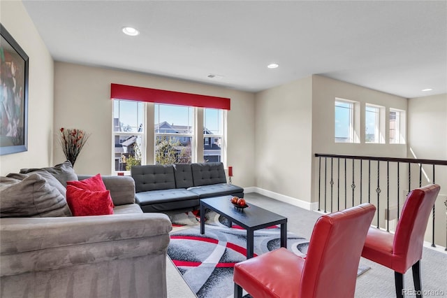 living area featuring carpet flooring, plenty of natural light, baseboards, and recessed lighting