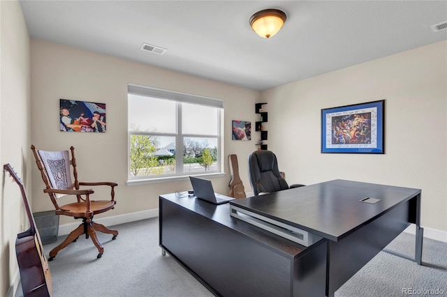 carpeted home office featuring baseboards