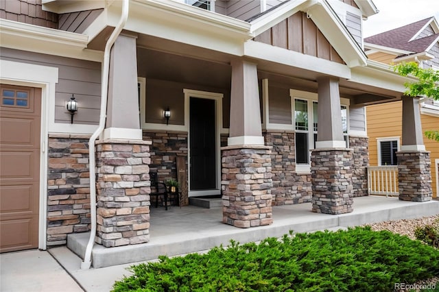 3421 E 143rd Dr, Thornton, CO 80602 - view of exterior entry with covered porch, stone siding, and board and batten siding