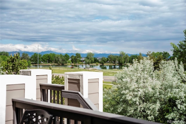 3421 E 143rd Dr, Thornton, CO 80602 - wooden deck featuring a water and mountain view