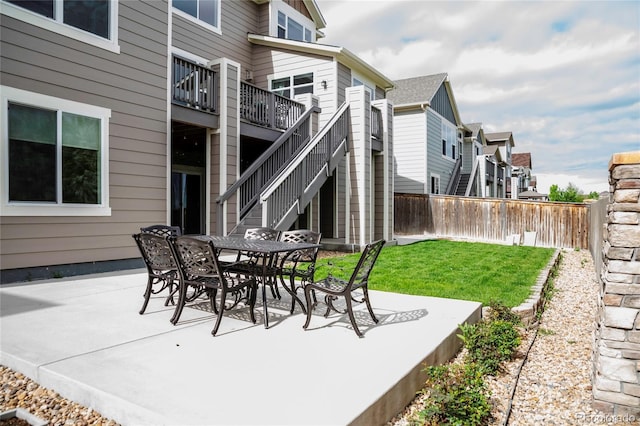 3421 E 143rd Dr, Thornton, CO 80602 - view of patio featuring stairway, a residential view, outdoor dining space, and a wooden deck