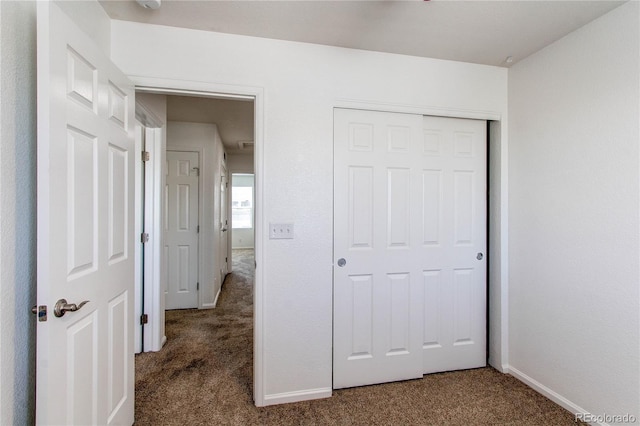 19043 E 58th Ave, Denver, CO 80249 - unfurnished bedroom featuring carpet and a closet