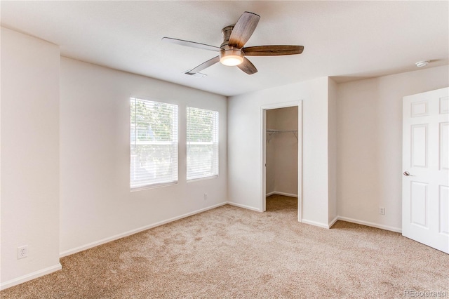 19043 E 58th Ave, Denver, CO 80249 - unfurnished bedroom with carpet flooring, a spacious closet, ceiling fan, and a closet