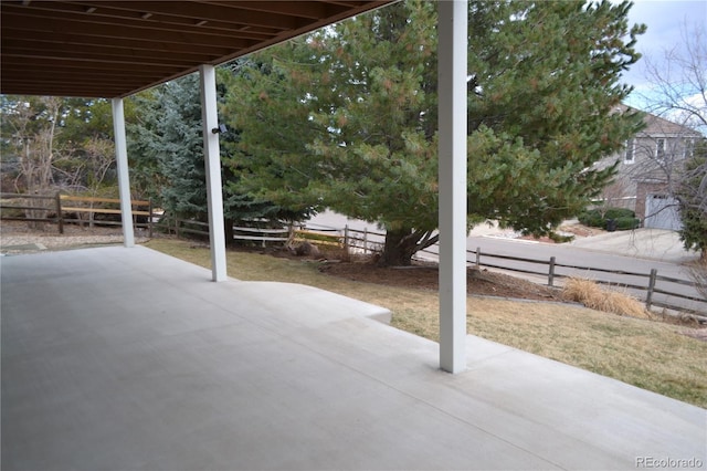 view of patio featuring fence