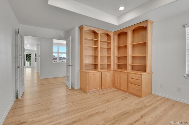 hallway with light wood-style flooring, baseboards, and recessed lighting