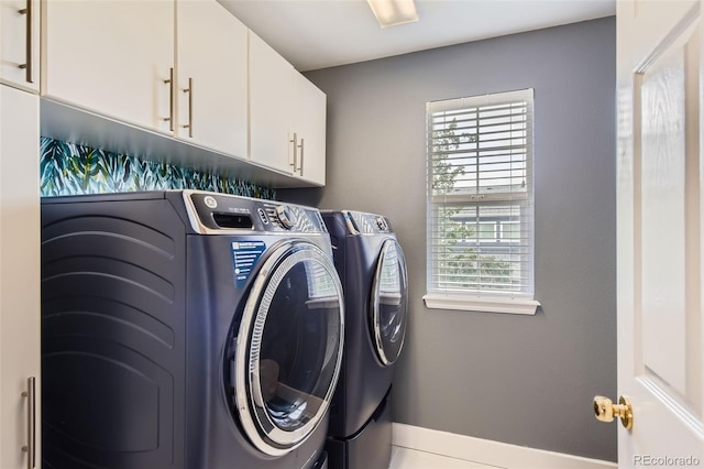 9458 S Hackberry Ln, Highlands Ranch, CO 80129 - laundry room with washing machine and clothes dryer, cabinet space, and baseboards