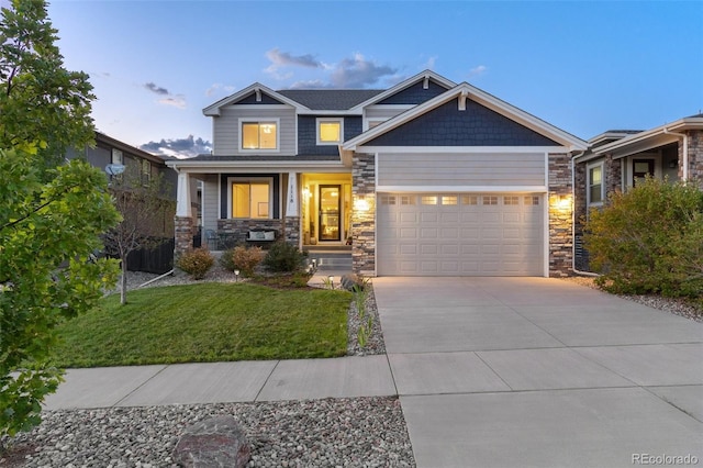 craftsman-style home with a porch, concrete driveway, an attached garage, stone siding, and a front lawn