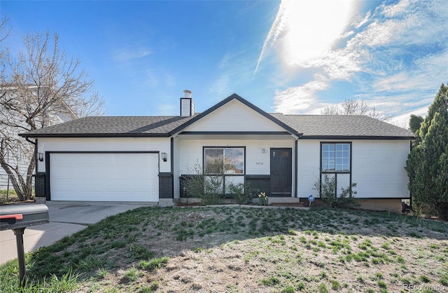 9712 Adams St, Thornton, CO 80229 - single story home featuring an attached garage, concrete driveway, and a chimney