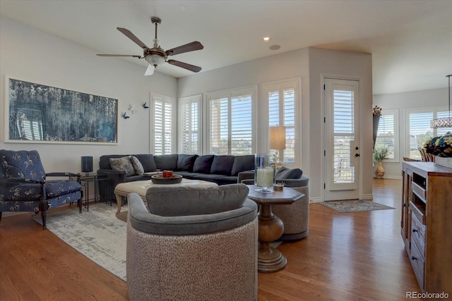 living room with hardwood / wood-style flooring and ceiling fan