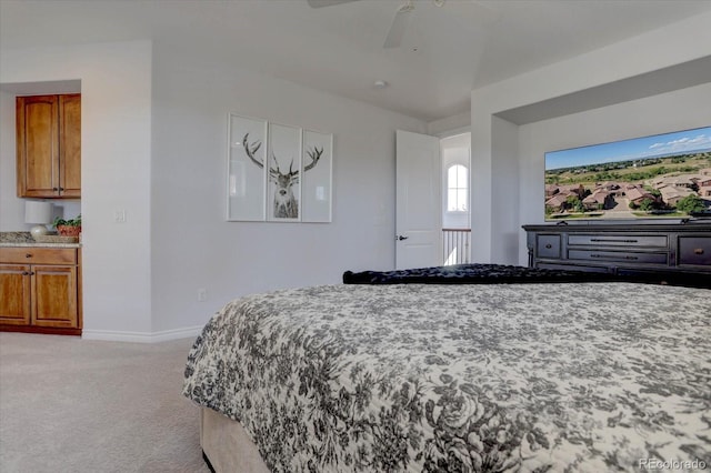 bedroom with ceiling fan and light carpet