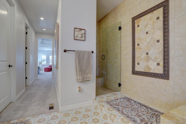 bathroom featuring tile patterned flooring and a shower with door