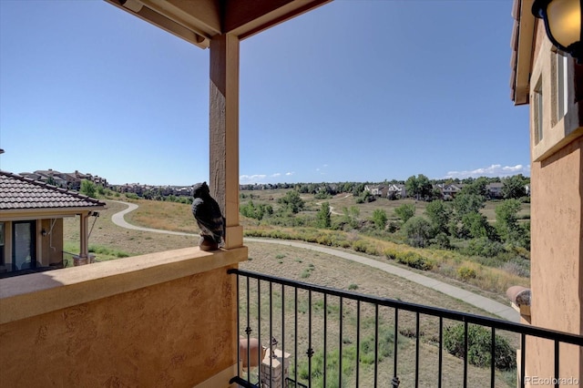 balcony featuring a rural view