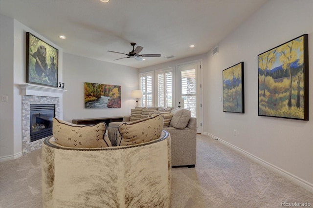 living room with ceiling fan and light colored carpet