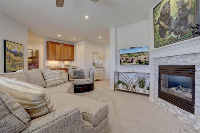 carpeted living room with a fireplace