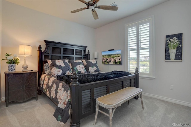 bedroom with ceiling fan and light carpet