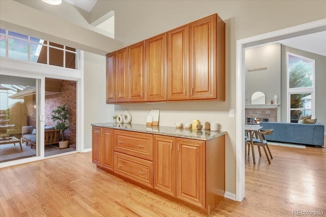 kitchen with a wealth of natural light and light hardwood / wood-style flooring