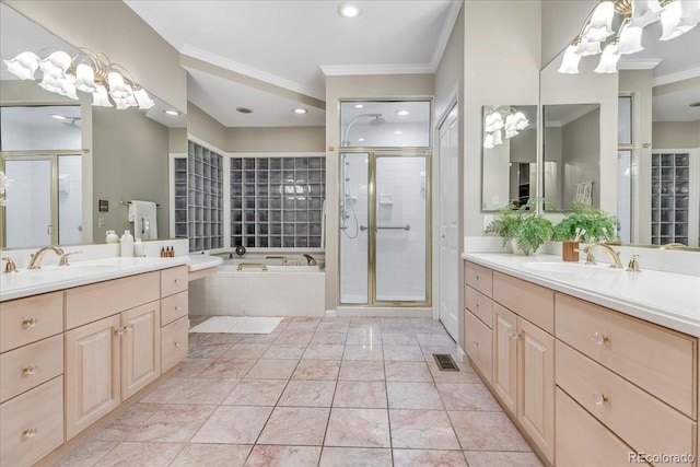 bathroom with an inviting chandelier, ornamental molding, independent shower and bath, tile patterned floors, and vanity