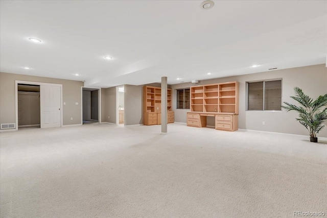 empty room featuring light colored carpet