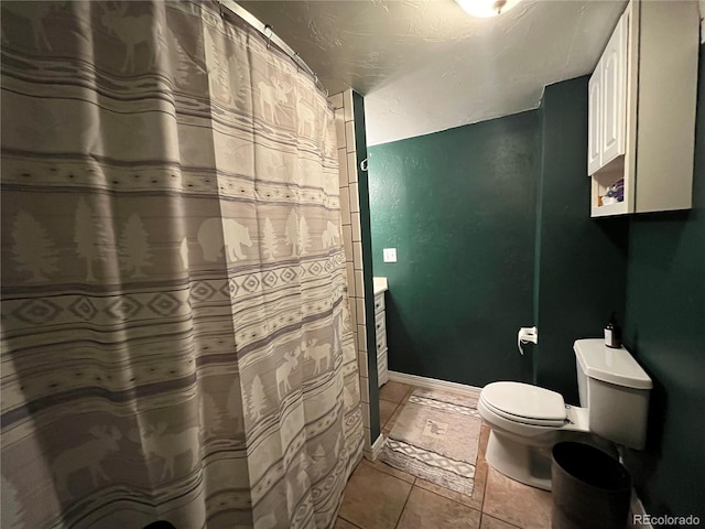 790 4th St, Limon, CO 80828 - full bath featuring toilet, tile patterned flooring, and curtained shower