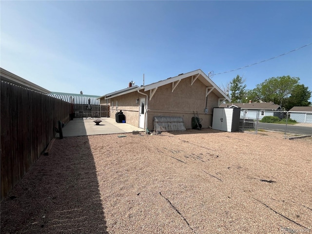 790 4th St, Limon, CO 80828 - rear view of property with a patio area, a fenced backyard, and stucco siding