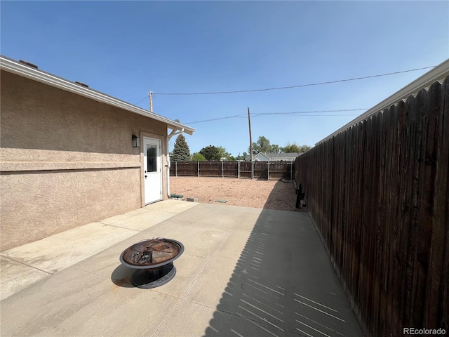 790 4th St, Limon, CO 80828 - fenced backyard with a fire pit and a patio area