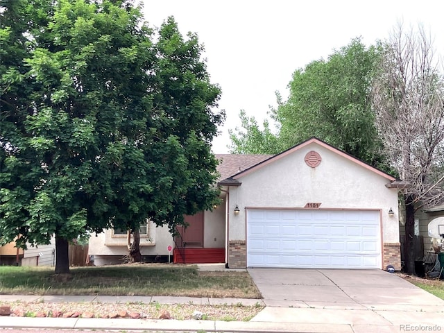 single story home featuring a garage