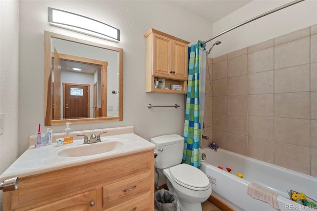 full bath with vanity, toilet, and shower / tub combo with curtain