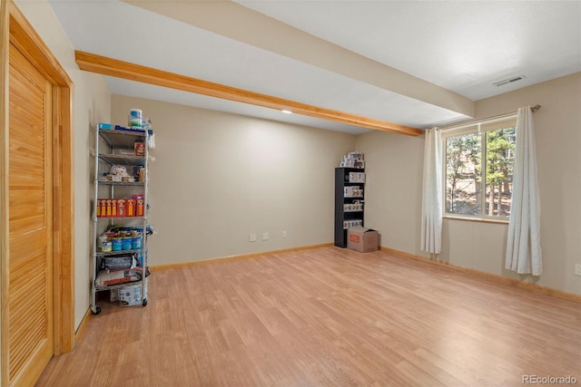 interior space with visible vents and wood finished floors