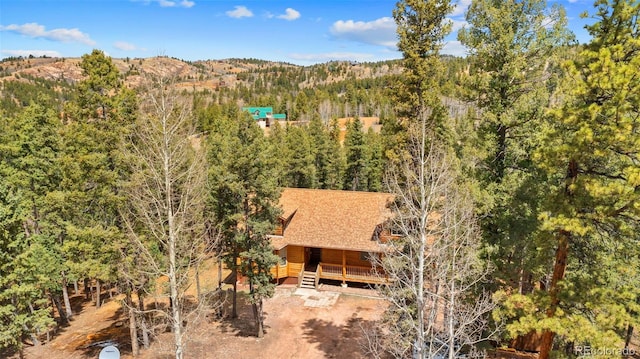 drone / aerial view with a forest view
